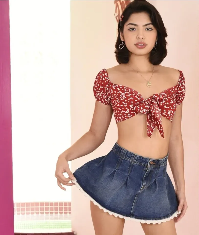 DP Diva editorial portrait: a performer in a red floral crop top and denim skirt
