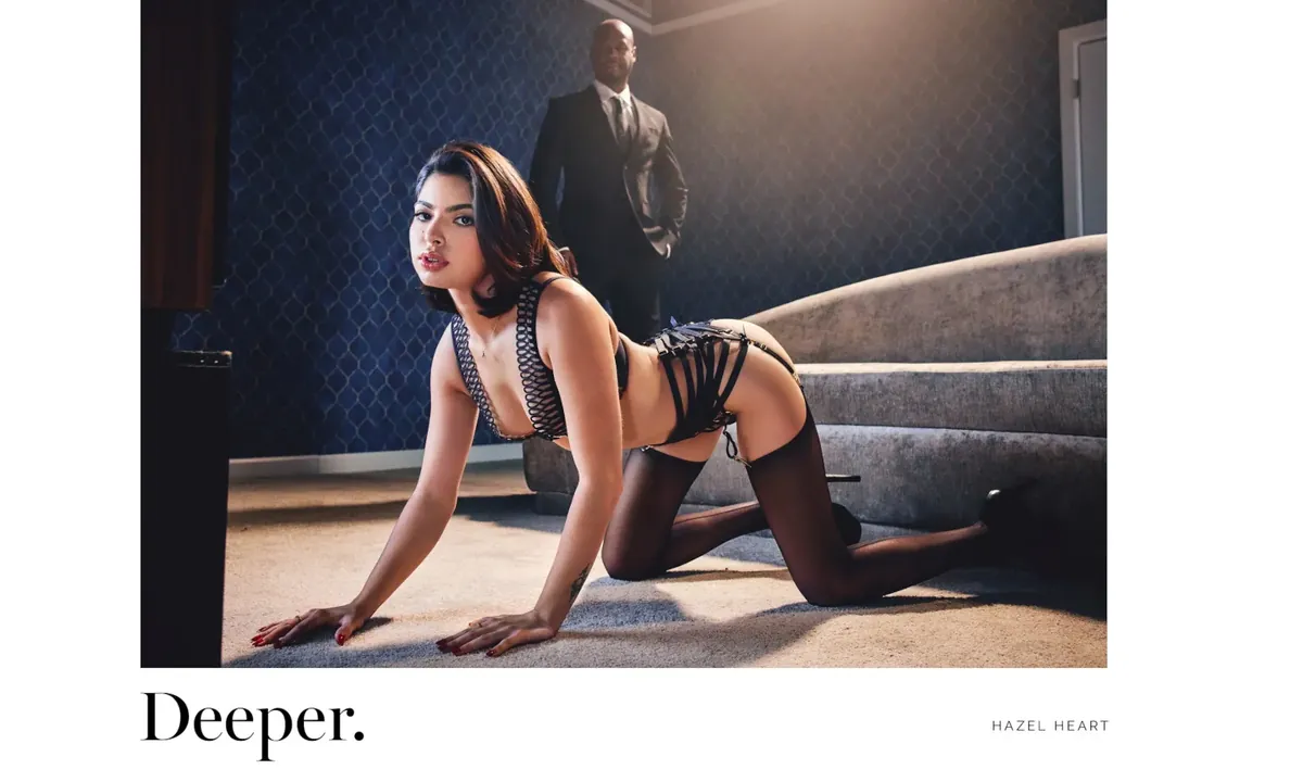 Deeper key art: a performer in black lingerie in a moody interior
