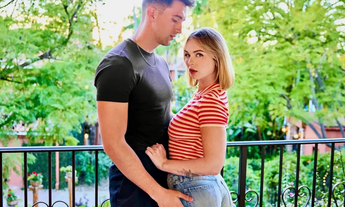 Vixen+ editorial still: a couple on a leafy terrace