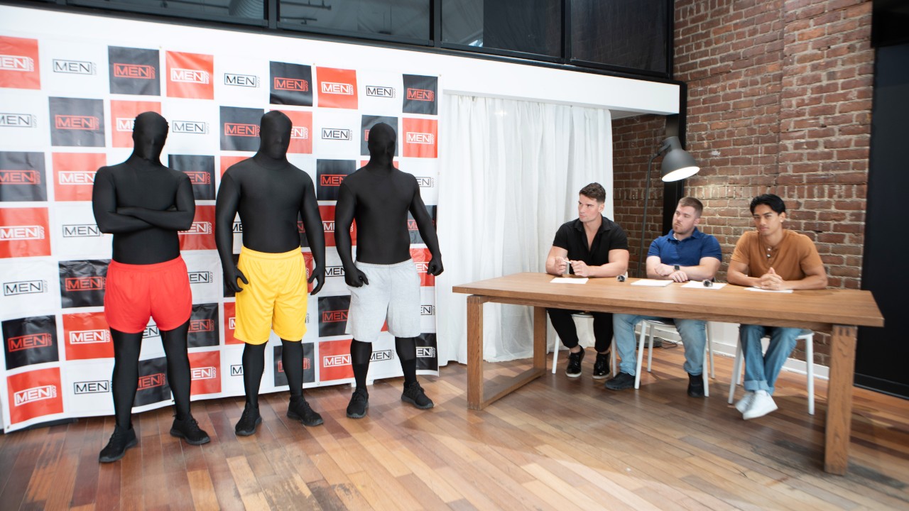 MEN scene still on a MEN-branded promo backdrop